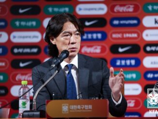 Hong Myungbo speaks at a press conference